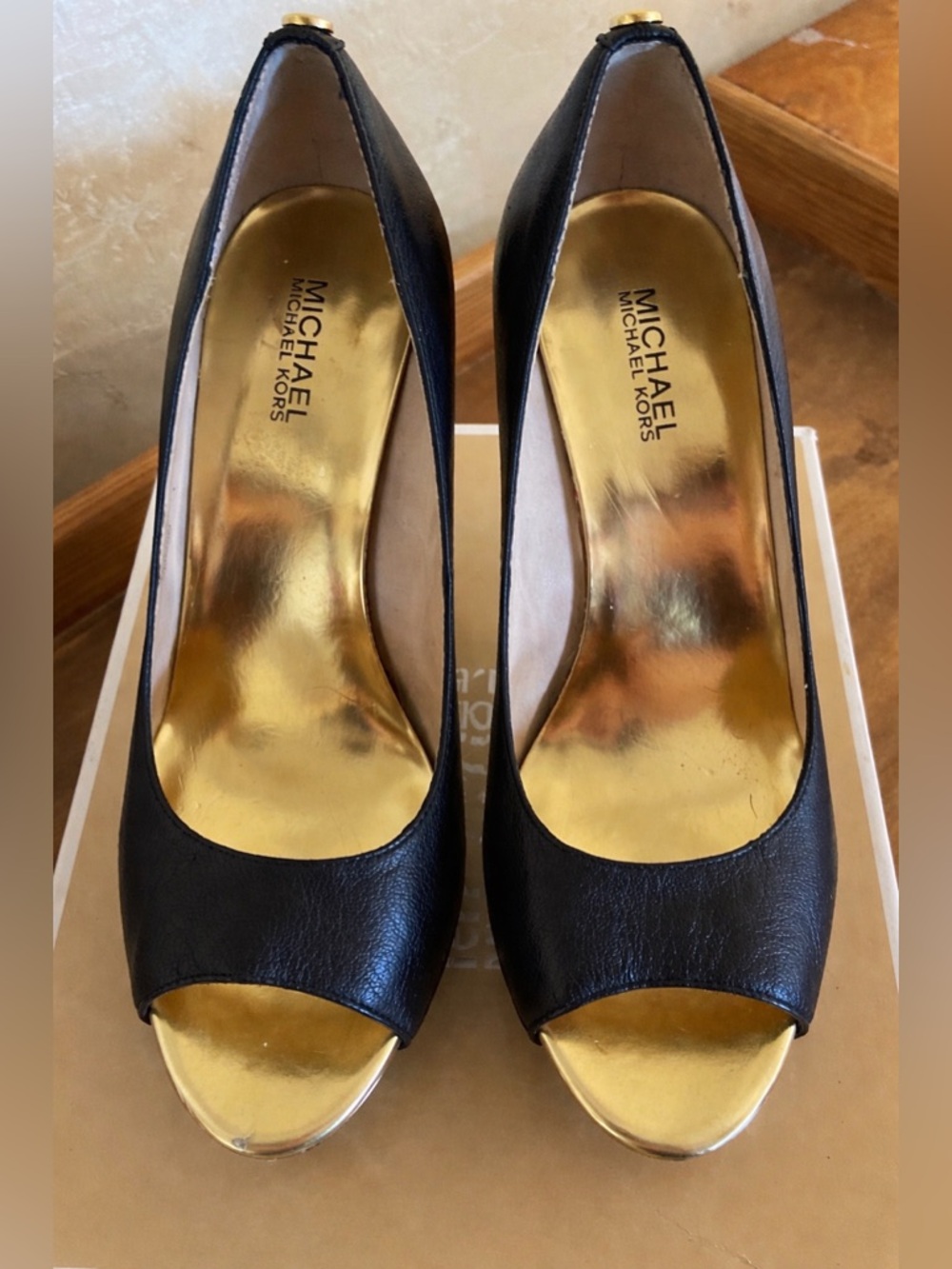Michael Kors Black Leather Peep-Toe Heels with Gold Accents.